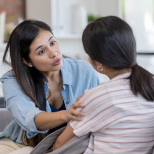 img of a woman talking to a child